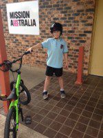 mission Australia kids receive team building bikes