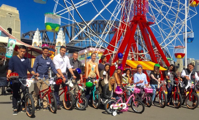 Team Building Bikes with 100 Westpac Graduates becoming Corporate and future Industry Leaders at Sydney Luna Park helping Kids Charities