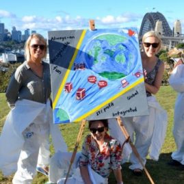 Corporate teams enjoy painting artistic team building activities in Sydney in view of the Harbour Bridge